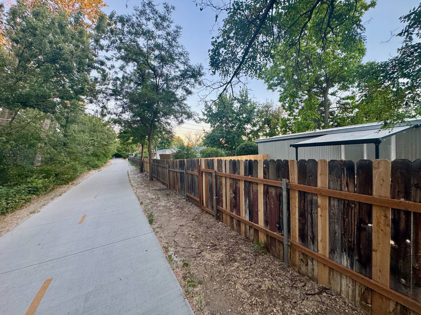 The Boise River Greenbelt path running directly alongside the Oasis back fence